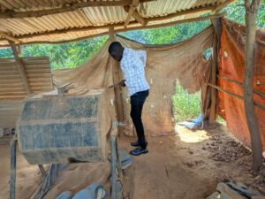 Benjamin Okech at a gold mining area in Bulumbi, Busia District, Uganda
